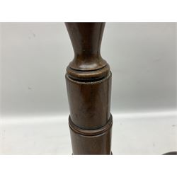 Pair of turned wooden candlesticks, the central column of stepped form raised upon circular spreading base, with drip trays, H56cm