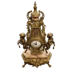 Imperial - 20th century continental 8-day brass and marble mantle clock, with an enamel dial, Roman numerals and pierced gilt hands, twin train striking movement sounding the hours and half hours on two bells, with a floating balance escapement.  With key.