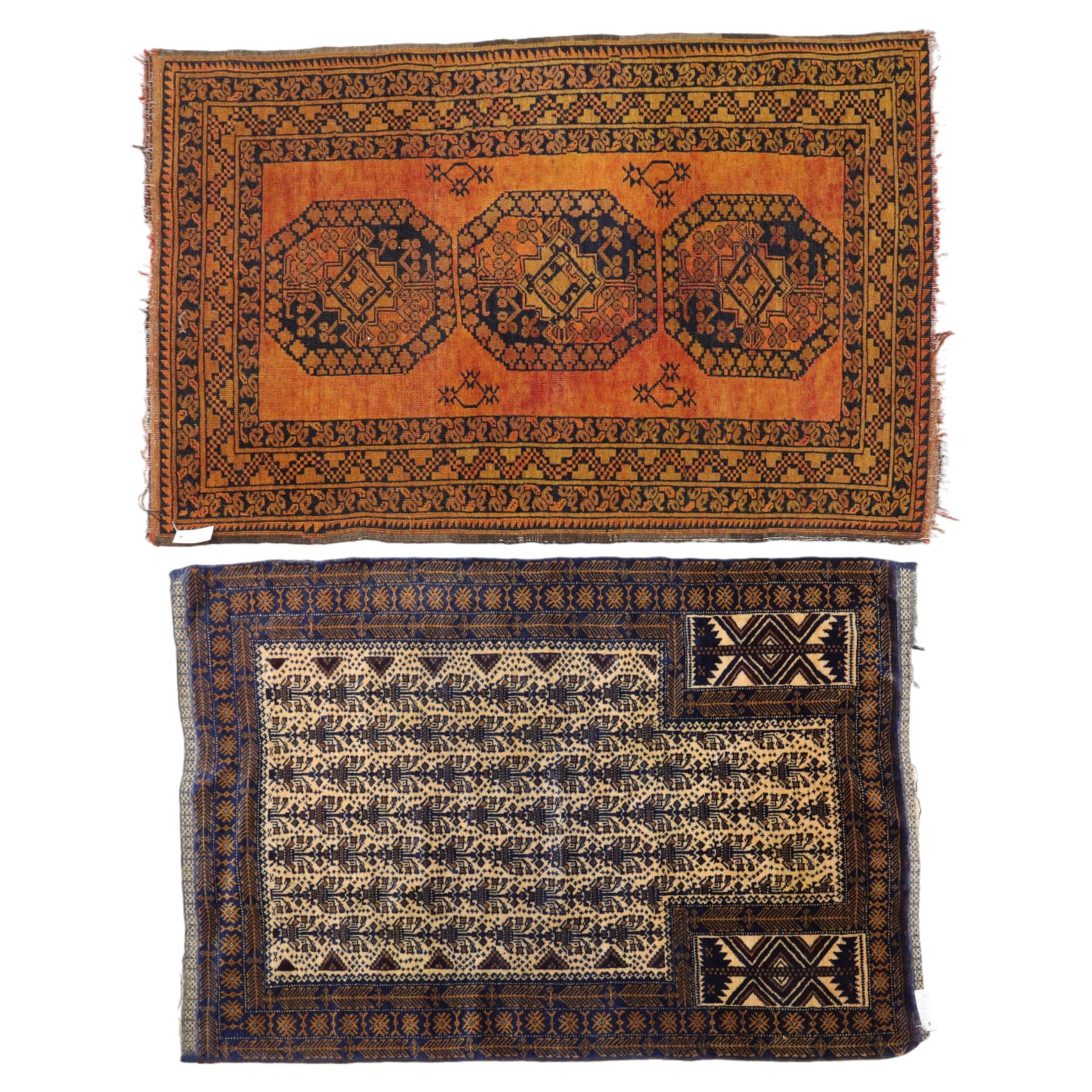 Afghan Ersari hand-knotted rug, apricot field decorated with three large octagonal gul medallions filled with geometric floral motifs, flanked by small tribal devices, end fringe fraying 97x167cm, together with a Baluch prayer rug, decorated with stylized tree motifs arranged in vertical rows beneath a stepped mihrab arch with multiple narrow borders of angular tribal motifs in shades of indigo, brown, and ochre fraying to flatweave ends, 134x84cm, (2)