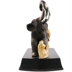 After Genryusai Seiya, modern bronzed model of an elephant being hunted by tigers, upon a black painted wooden base, height including base H45cm
