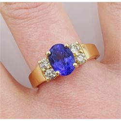 Gold oval tanzanite and round brilliant cut diamond ring, stamped 14K