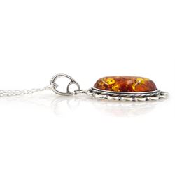 Silver Baltic amber oval pendant necklace, stamped 925 
