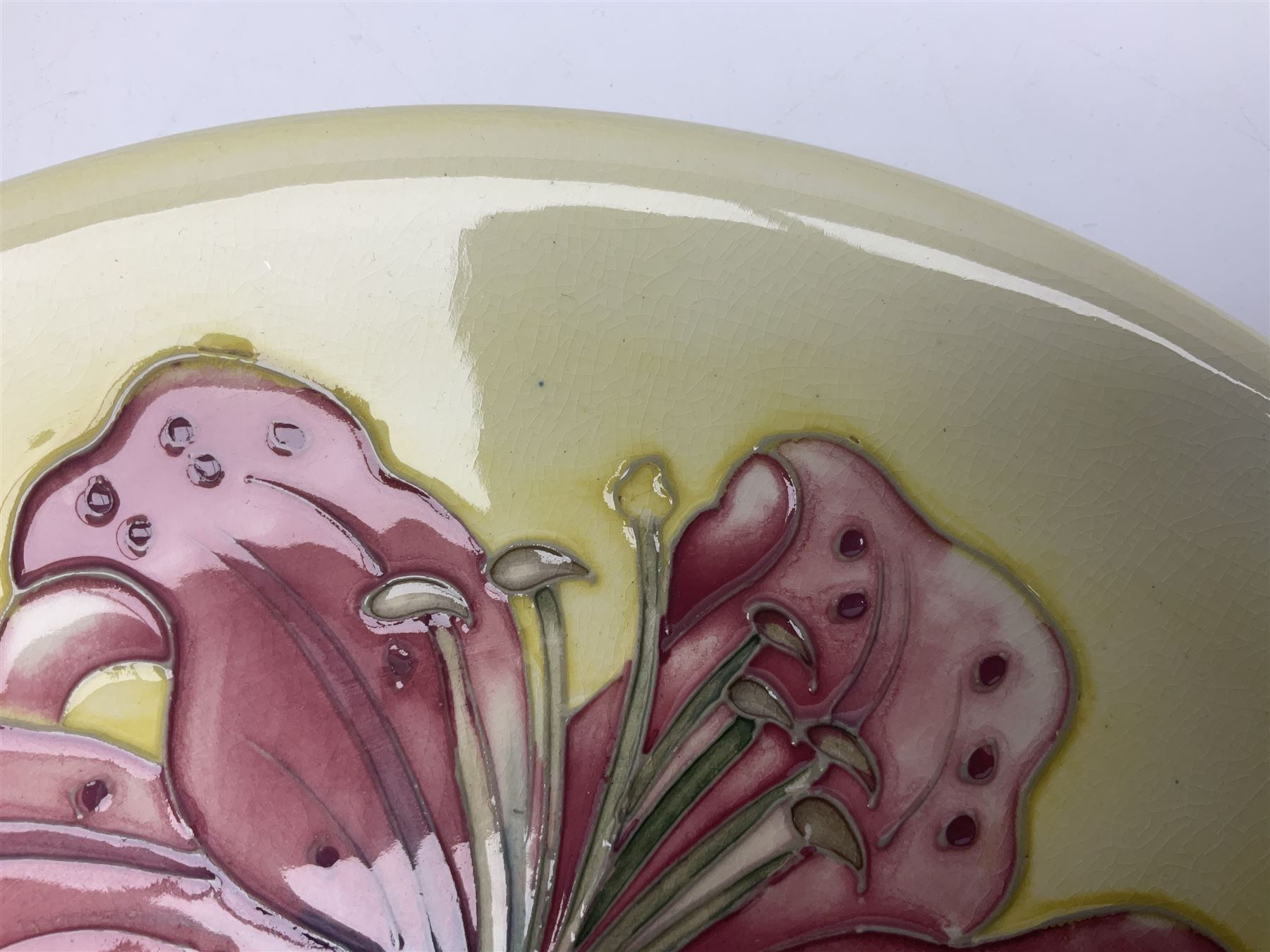 Moorcroft Tiger Lily pattern plate on a yellow ground, with painted and impressed mark beneath, D26cm