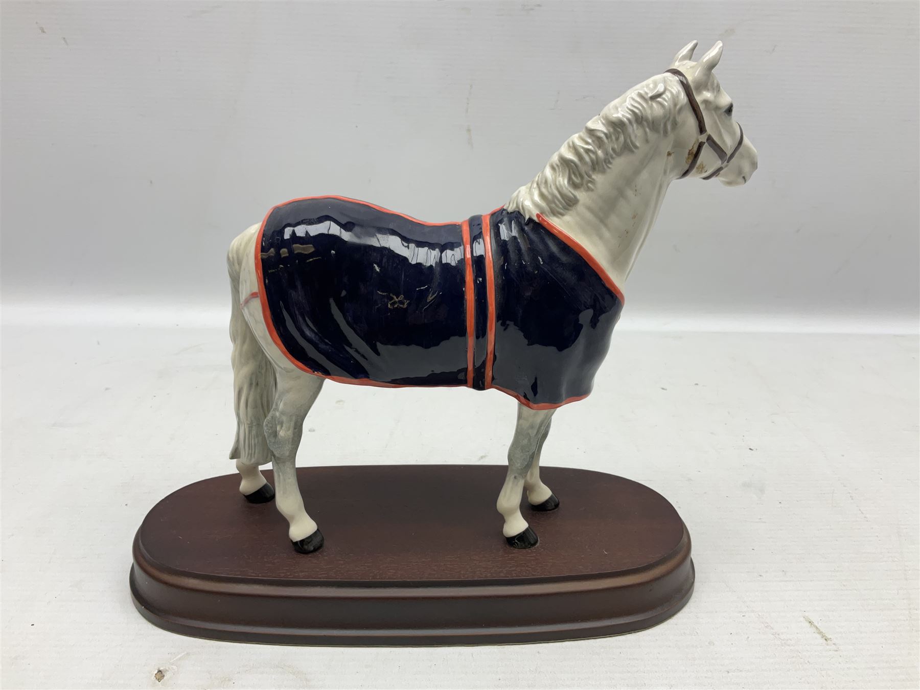 Beswick figure, grey Welsh Mountain Pony in a blue rug on plinth, no A247 H23cm