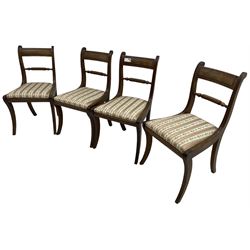 Set of four Regency period mahogany dining chairs, rope-twist centre back bar over pink and ivory floral patterned drop-in seats, on reed moulded sabre supports