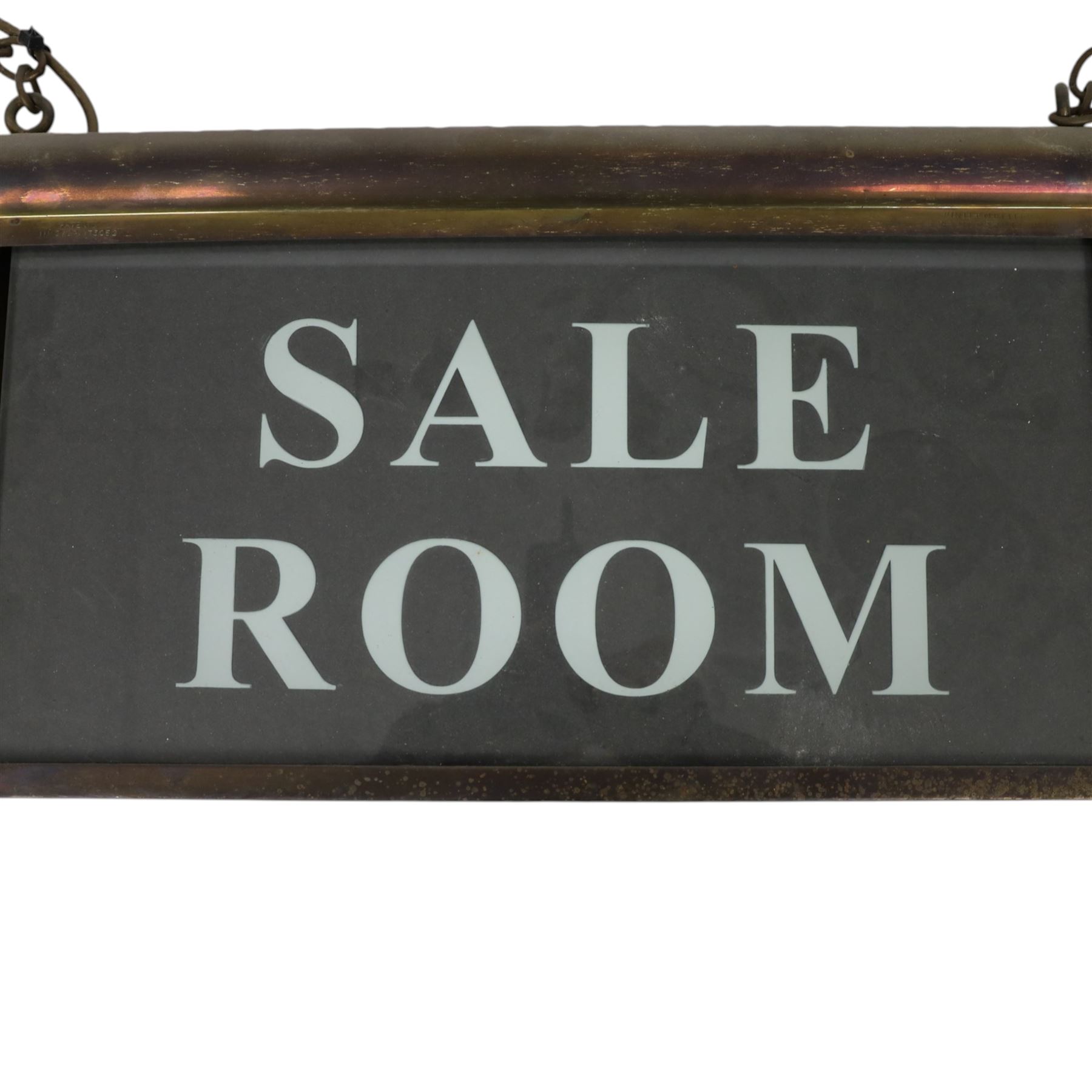 Early 20th century brass ceiling hanging illuminated sign 'sale room', H27cm, L48cm