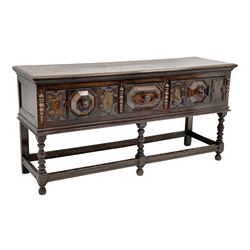 17th century style oak dresser base, rectangular moulded top, three drawers with raised geometric moulded panels and walnut inlays, split moulded mounts to front, turned supports jointed by stretchers, W185cm, H91cm, D51cm