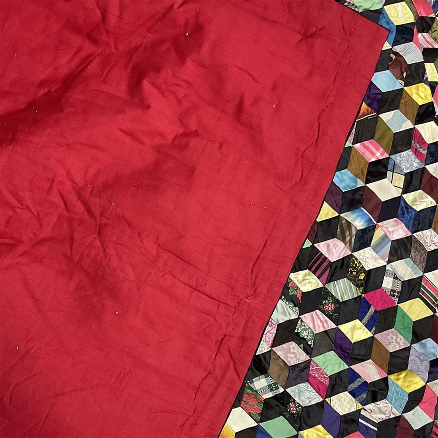 19th Century silk and satin tumbling blocks pattern patchwork quilt with black border 228cm X 196cm