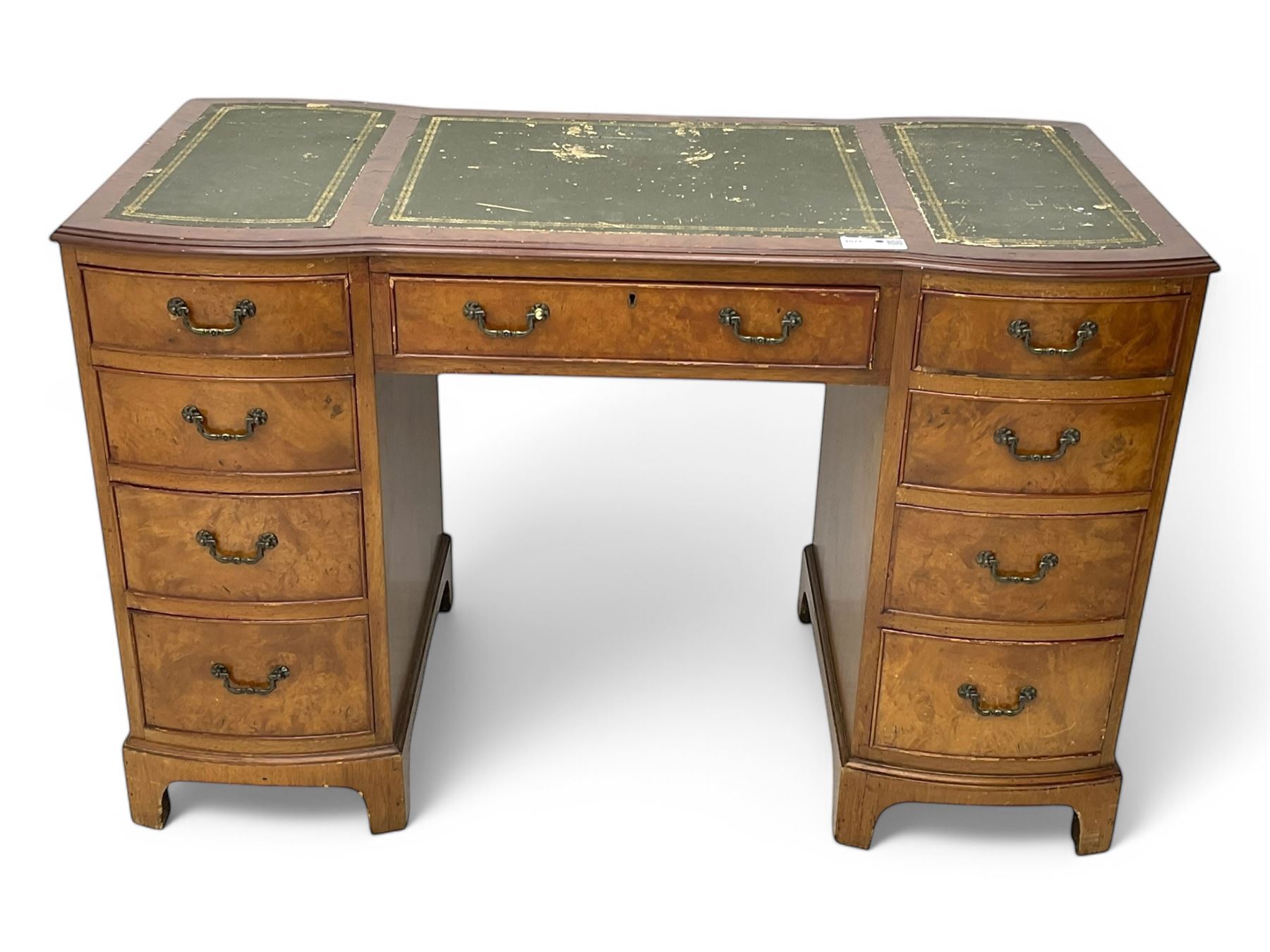 Queen Anne design burr walnut pedestal desk, of serpentine form with green tooled leather inset top, nine drawers with brass swan-neck handles, raised on bracket feet, in three parts