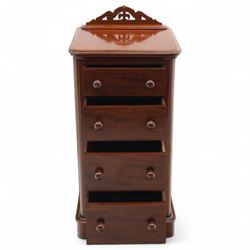 Pair of tall Victorian mahogany bedside chests, of narrow upright form, rectangular top with moulded edge, the back with raised pierced fretwork gallery, above four graduated drawers with knob handles, raised on a plinth base 