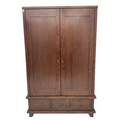 Willis Gambier double wardrobe, enclosed by two doors, fitted with three drawers