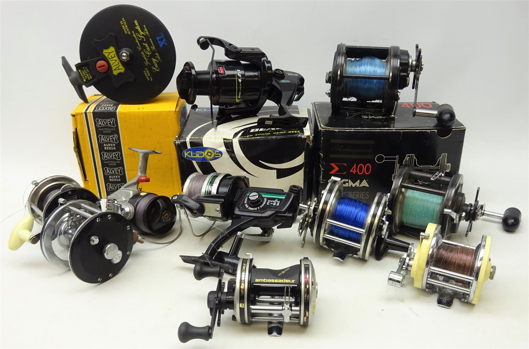 Collection of fishing reels including Abu Garcia ambassadeur 6500-c3, Alvey  500B-C XL, boxed, Shakespeare E400 Sigma 2960 series, boxed, Kudos Beach  700, boxed, Garcia 'Mitchell 602' and six other re - Antiques