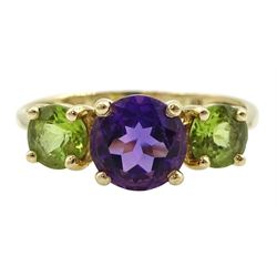 14ct gold three stone amethyst and peridot ring, stamped 585