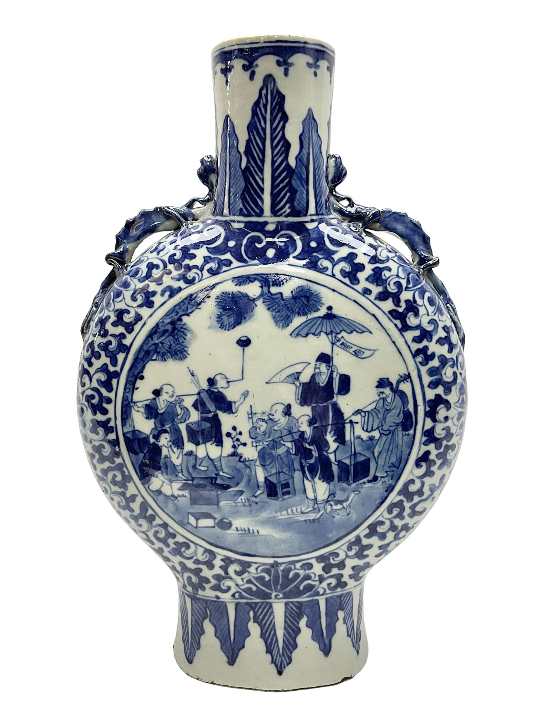 19th century Chinese blue and white moon flask vase, the central panel depicting musicians, bordered by floral, foliate and scroll decoration, with lizard handles to each shoulder, upon an oval foot, H31cm 