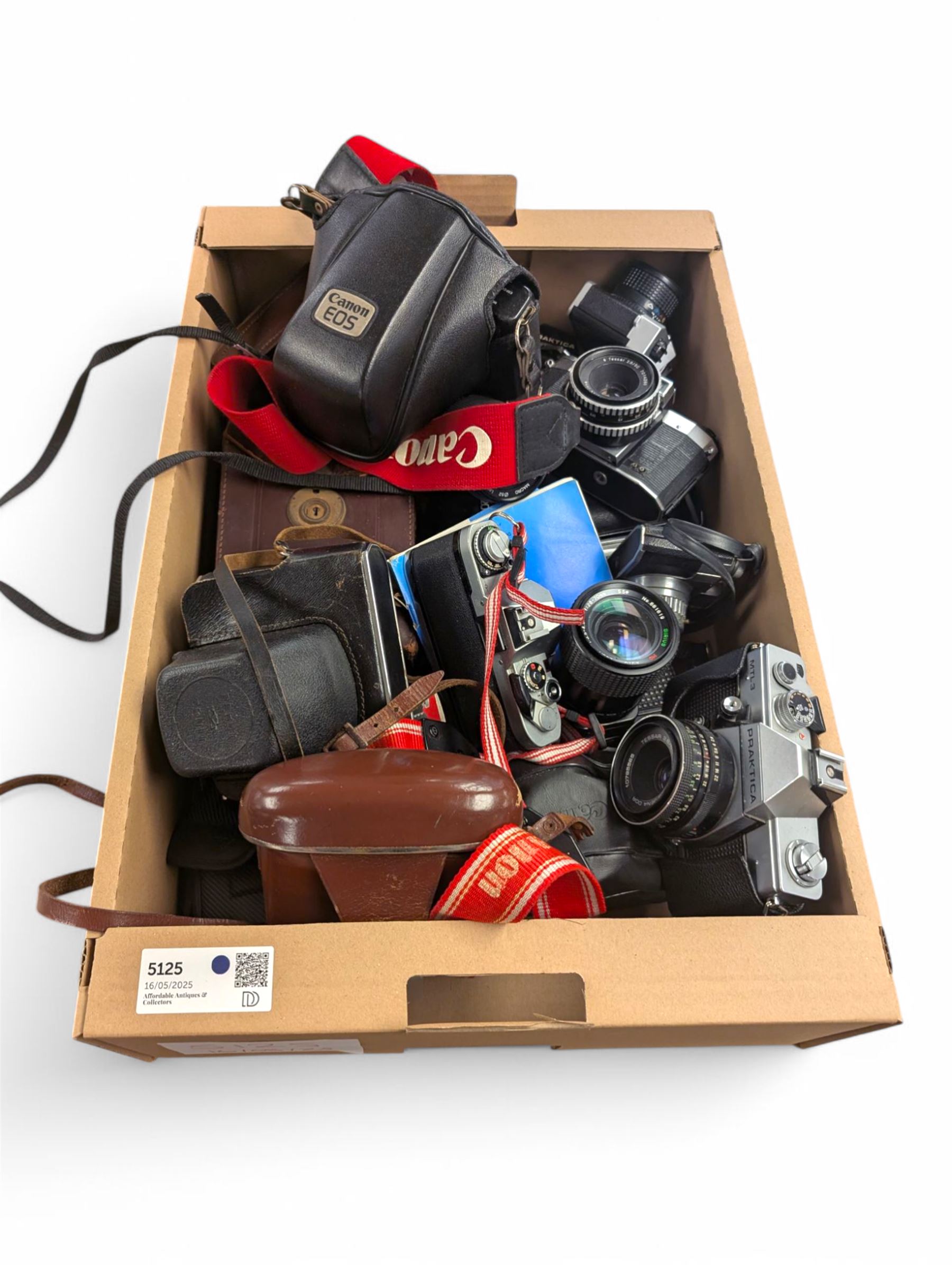 Collection of cameras, including Canon EOS 650, Praktica BMS, Inovar, Praktica MTL3, Zeiss Ikon Contina, etc