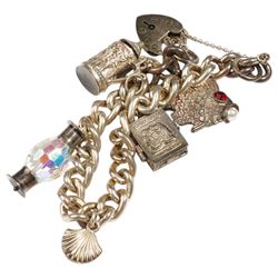 Silver charm bracelet including fish, shell and tankard and two additional silver charms