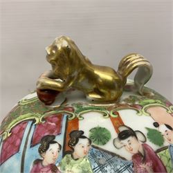Pair of 19th century Chinese Famille Rose vases and covers, each of baluster form with twin gilt lion mask ring handles to shoulders, the flattened domed covers with gilt temple lion finials, each decorated with alternating reserves of bijin and attendants, and birds and butterflies amongst blossoming peonies, against a gilt ground profusely decorated with stylised scrolls, H32.5cm