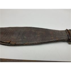 African Mandingo sword, the 75cm triple fullered blade with leather covered grip and brass pommel, in part leather covered scabbard with leaf shaped point L98cm overall