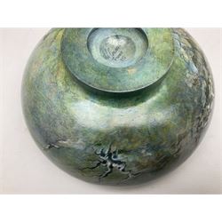 Wooden hand painted bowl, decorated with trees on a blue ground, signed Phil Crennell beneath, D28cm