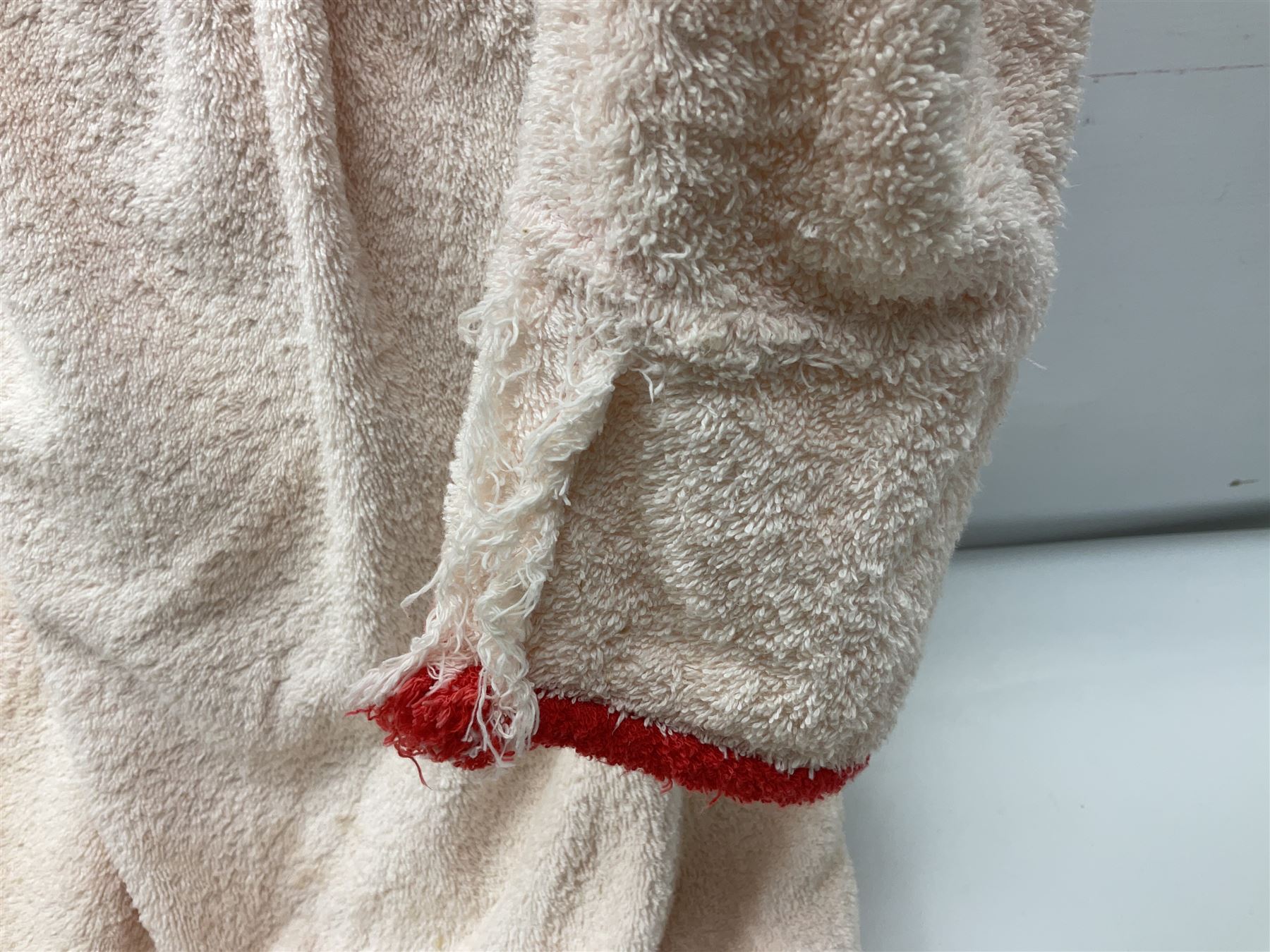 On the direct instructions of Anita Porter nee Lonsbrough Great British Olympic and Commonwealth Games gold medal winning swimmer - collection of early and international memorabilia comprising original Huddersfield Bath Club track suit top bearing eight stitched on cloth badges including British Empire & Commonwealth Games 1958 England Team, YSASA, North Eastern Counties ASA, ESSA Division 3,  English Schools Swimming Association winner etc
The swimming costume Anita wore at the 1958 Commonwealth Games in Cardiff, her first major championships, where she won two gold medals. The grey elastic on the sides, in those days, she would use to make it tighter and more streamlined.
Blue track suit from the 1960 Olympics which she wore on the podium receiving the gold medal.
1960 pool side towelling robe used at the Rome Olympics (interesting to note her name is spelt wrong on the embroidered label).
1962 Commonwealth Games pool side towelling robe used in Perth Australia when winning three Gold medals. 
It was also this year she became BBC Sports Personality of the year, the first female to do so.
Her 'lucky' pool side towel which she took with her to every event she competed in and which can be seen round her neck in many official celebratory photographs. Copies of some of these photographs are included for identification.
In addition there are two souvenir programmes of an evening event to honour Anita at The Theatre Royal Huddersfield and she has kindly signed the front cover on one of these.