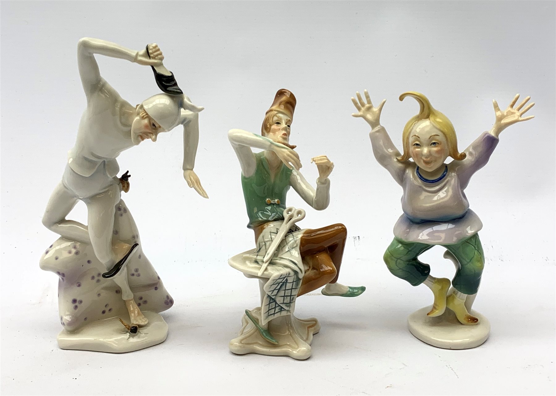 Three 20th century Karl Ens figurines, the first modelled as Uncle Fritz, the second modelled as Bock the Tailor, the third modelled as a sprightly female figure, each with printed blue mark to base, largest H20cm. 