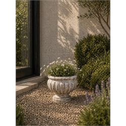 Small marble campana pedestal urn, fluted lobes raised on circular pedestal foot