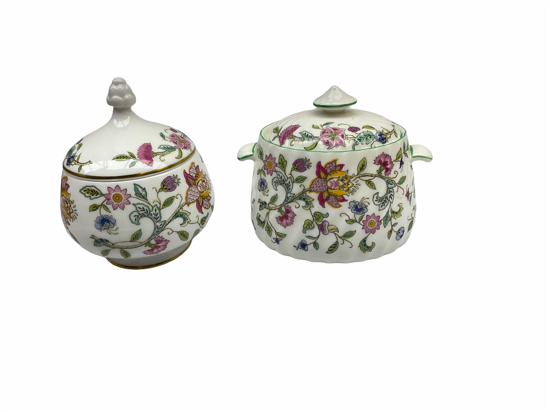 Minton Haddon Hall pattern tea and dinner wares, including basket dish, two covered tureens, six dinner plates, eight dessert plates, twelve tea plates, six soup bowls, six cereal bowls, teapot, coffee pot, milk jug, covered sucrier twelve tea cups and saucers, six mugs, footed bon bon dish, pair of candlestick holders, cake knife and slice etc (81)