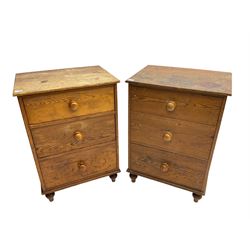 Pair early 20th century pitch pine chests, fitted with three graduating drawers, on turned feet