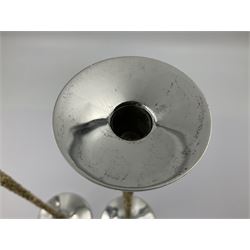 Pair of modern silver candlesticks by Stuart Devlin, the tapering parcel gilt stems with signature textured detailing, each supporting a fluted candle holder and upon a spreading circular foot, hallmarked Stuart Devlin, London 1973, H25cm