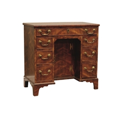  20th century Georgian style mulberry wood kneehole desk with an arrangement of seven drawers and a cupboard on shaped bracket feet, top drawer stamped G. Burton, W78cm, D44cm, H75cm   