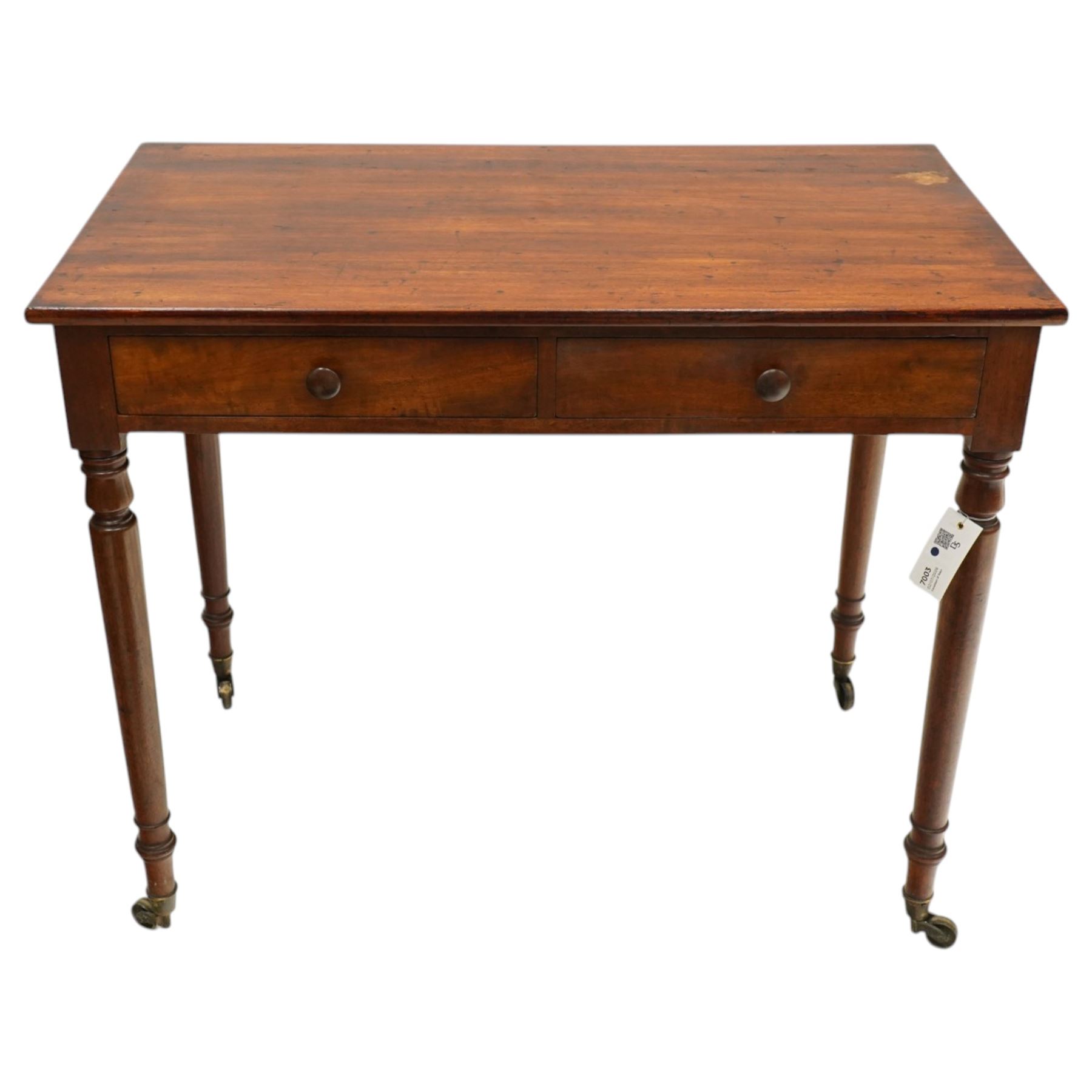Victorian mahogany side table, rectangular top, two short drawers one compartmented, raised on turned supports with castors