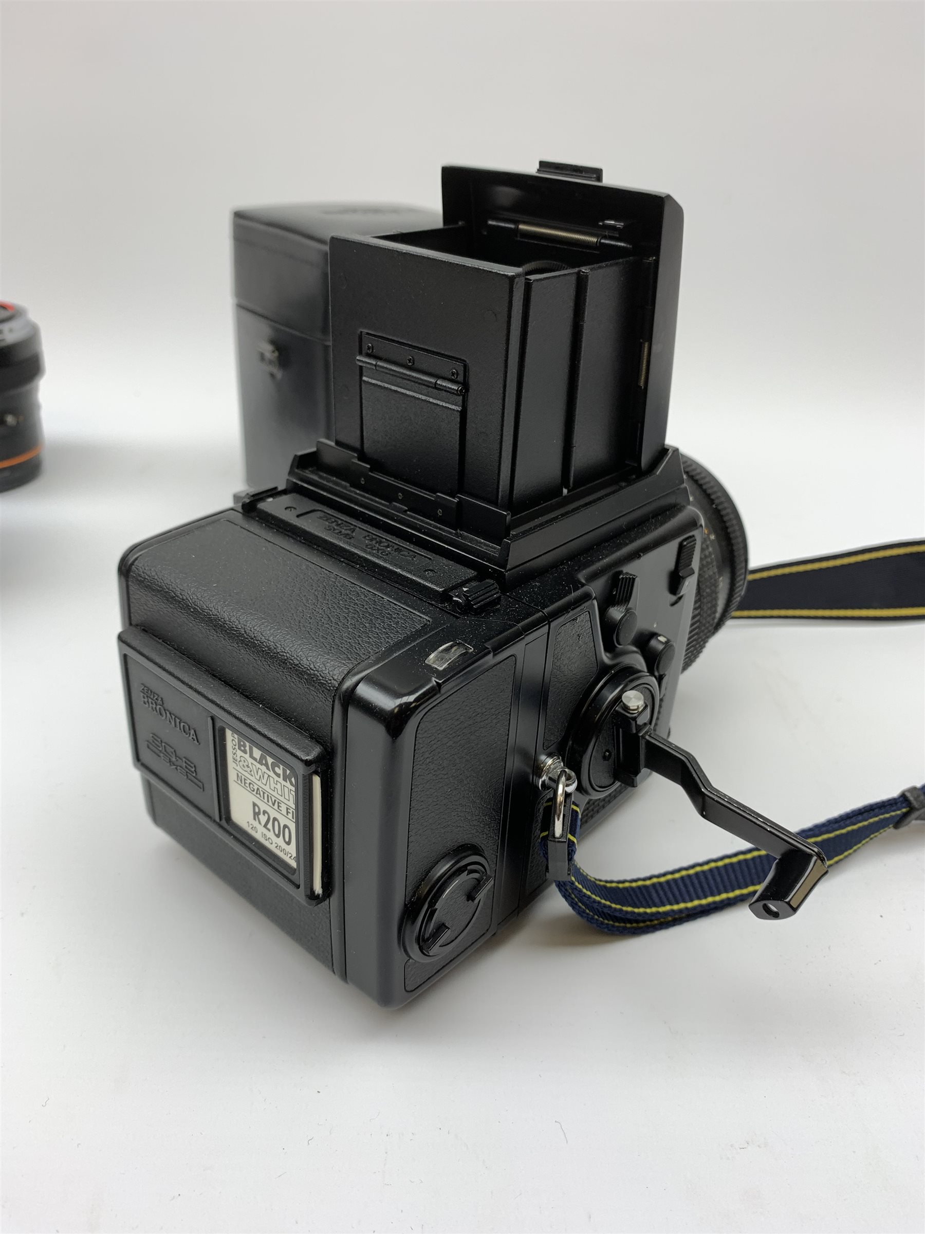 'Zenza Bronica SQ-B' camera fitted with 'Zenza Bronica Zenzanon-PS 1:28 f=80mm' lens, 'Zenza Bronica Zenzanon-PS 1:4 f=150mm' lens and 'Zenza Bronica Zenzanon-S 1:35 f=50mm' lens, with an instruction booklet