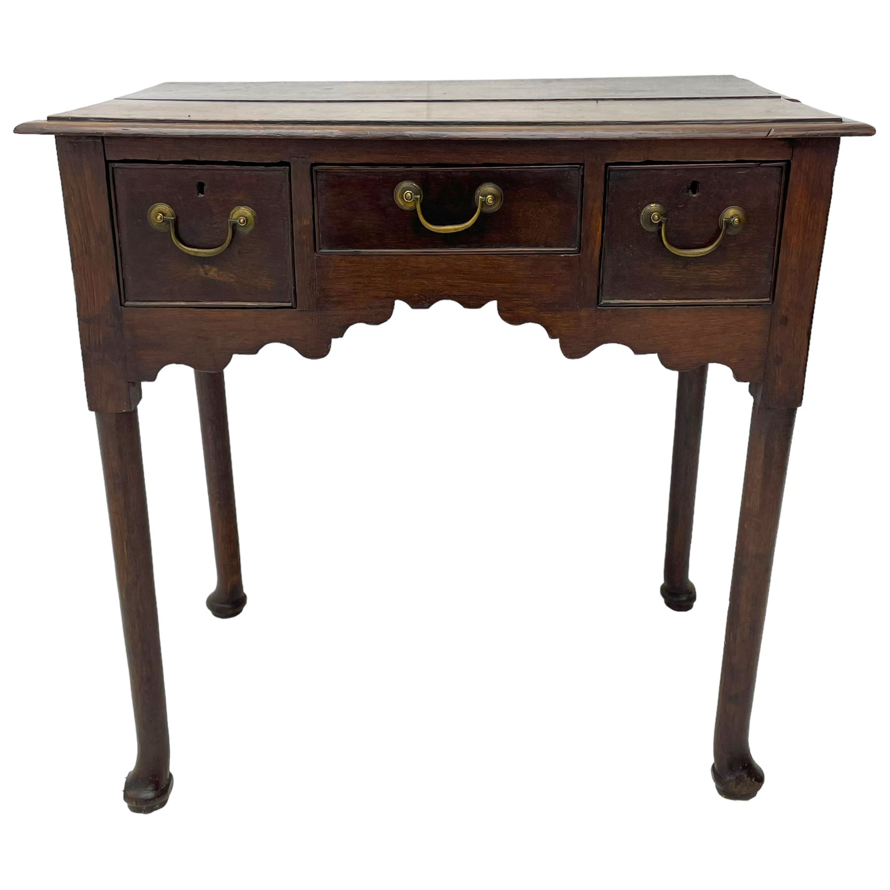 18th century oak low-boy, ovolo-moulded rectangular top over three cock-beaded drawers, circular brass handle plates and D-shaped handles, shaped and stepped arched apron, on cabriole supports 