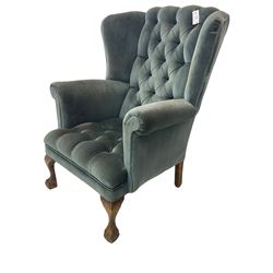 Georgian design wingback armchair, traditional shape with rolled arms, upholstered in teal velvet fabric, on cabriole supports with ball and claw feet