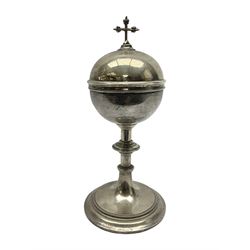 Early 20th century ciborium, the circular silver bowl with domed cupronickel cover and cross finial, upon a metal knopped stem and circular spreading foot, H23cm