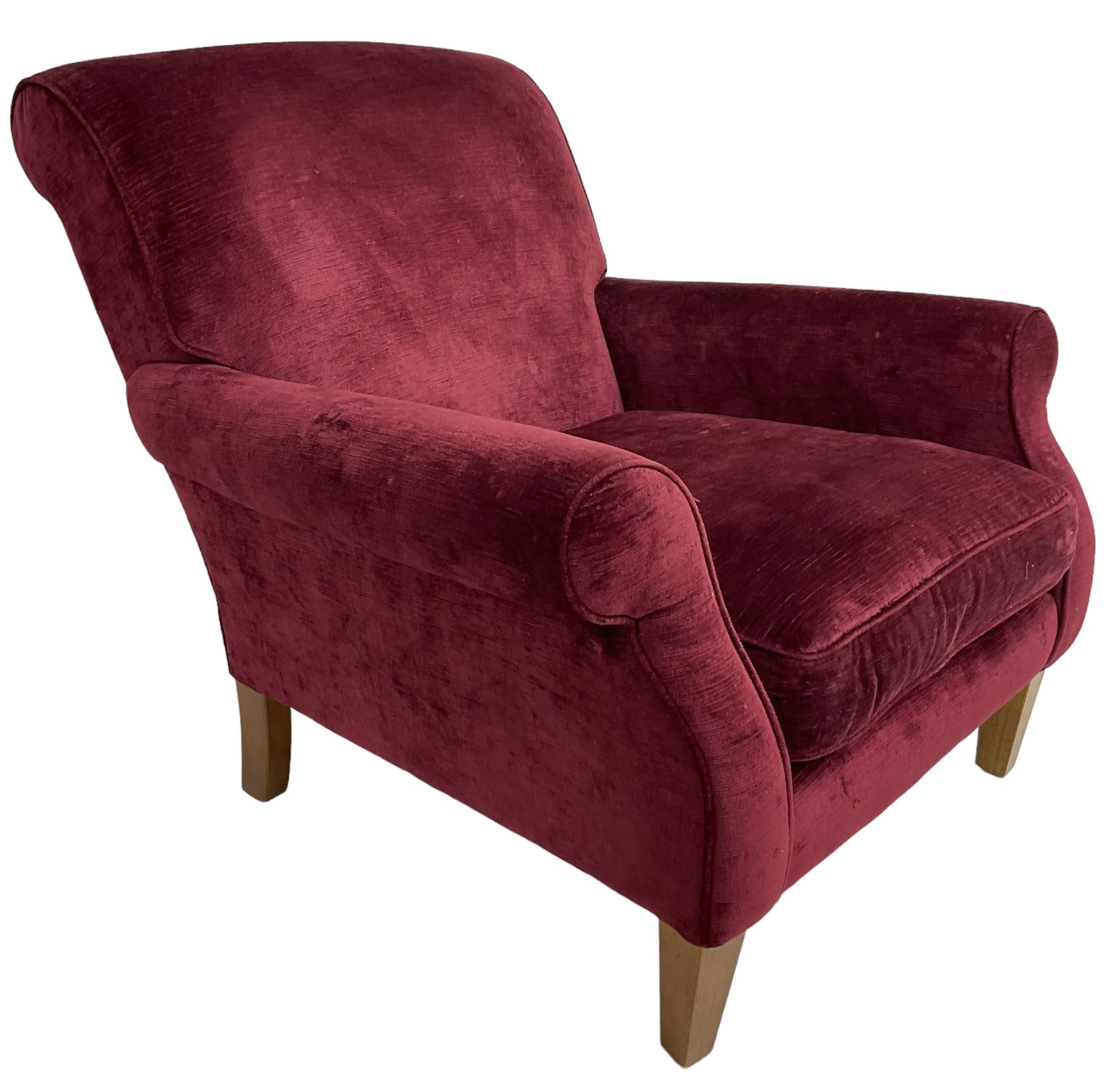 Duresta - traditional shape armchair upholstered in burgundy red velvet, on square tapering front supports (W88cm, H85cm, D103cm); together with a matching rectangular footstool with hinged seat, on turned feet with brass castors (73cm x 54cm, H38cm)