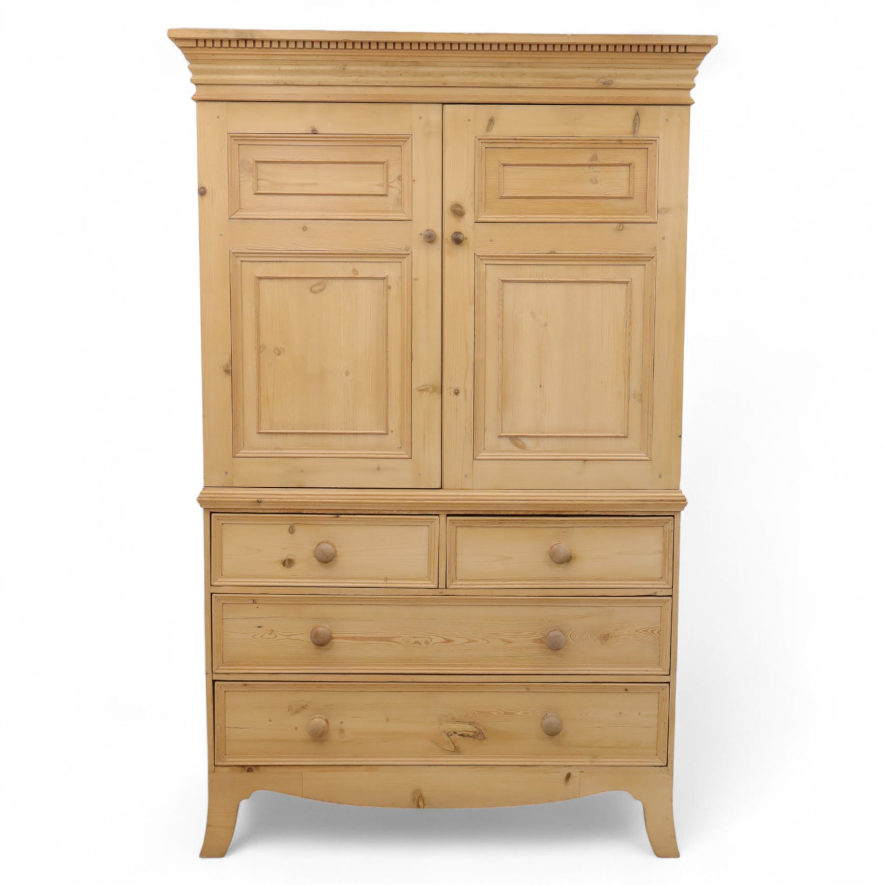 Georgian design waxed pine linen press, dentil moulded cornice above a pair of panelled cupboard doors enclosing storage interior, over two short and two long drawers with turned wooden knobs, raised on shaped bracket supports