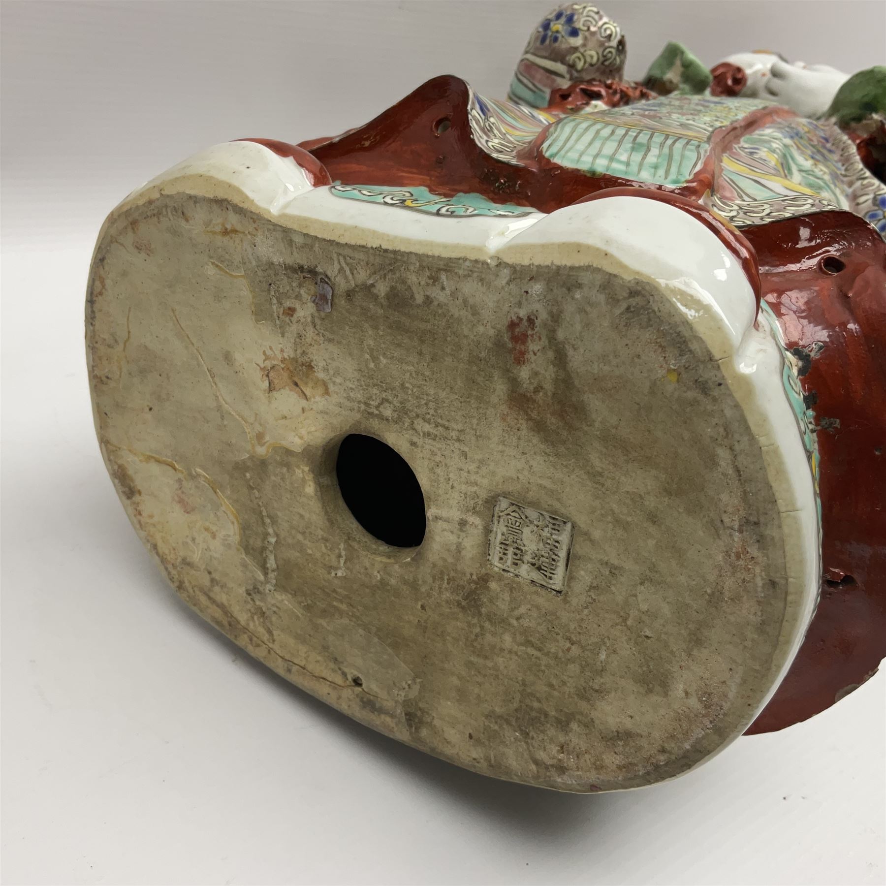 Chinese Republic Period porcelain figure, modelled as Shoulao, wearing elaborately enamelled robes decorated with peaches and flower heads, with impressed mark beneath, H55cm