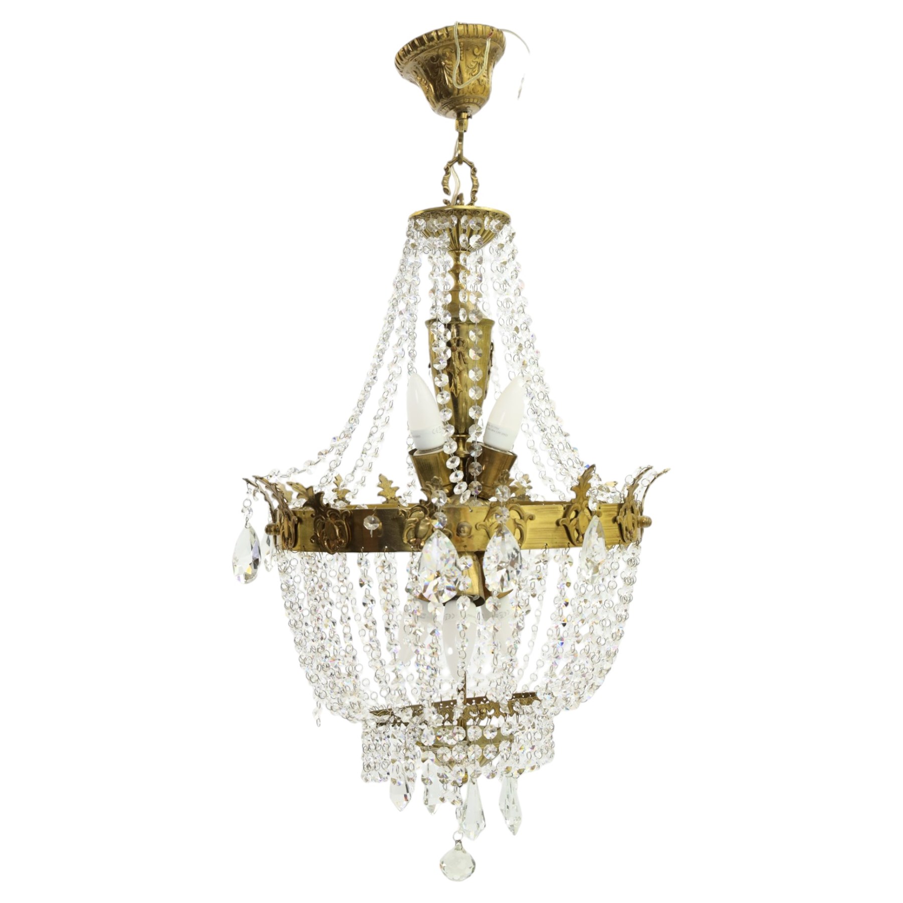 Empire design brass and crystal chandelier, the two circular brass tiers with foliate mounts, connecting the cascading crystal garlands, with prismatic drops