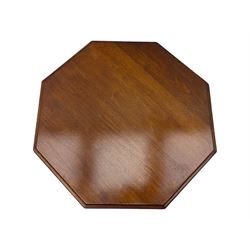 Victorian oak occasional table, octagonal top with bevelled edges, lower section fitted with a square undertier united by decorative shaped stretchers, on turned supports with castors