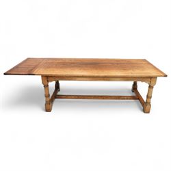 Late 20th century oak refectory table in 17th century style, with plank top and end leaf, raised on ring turned baluster legs with square feet, joined by conforming stretchers (260 cm extended)