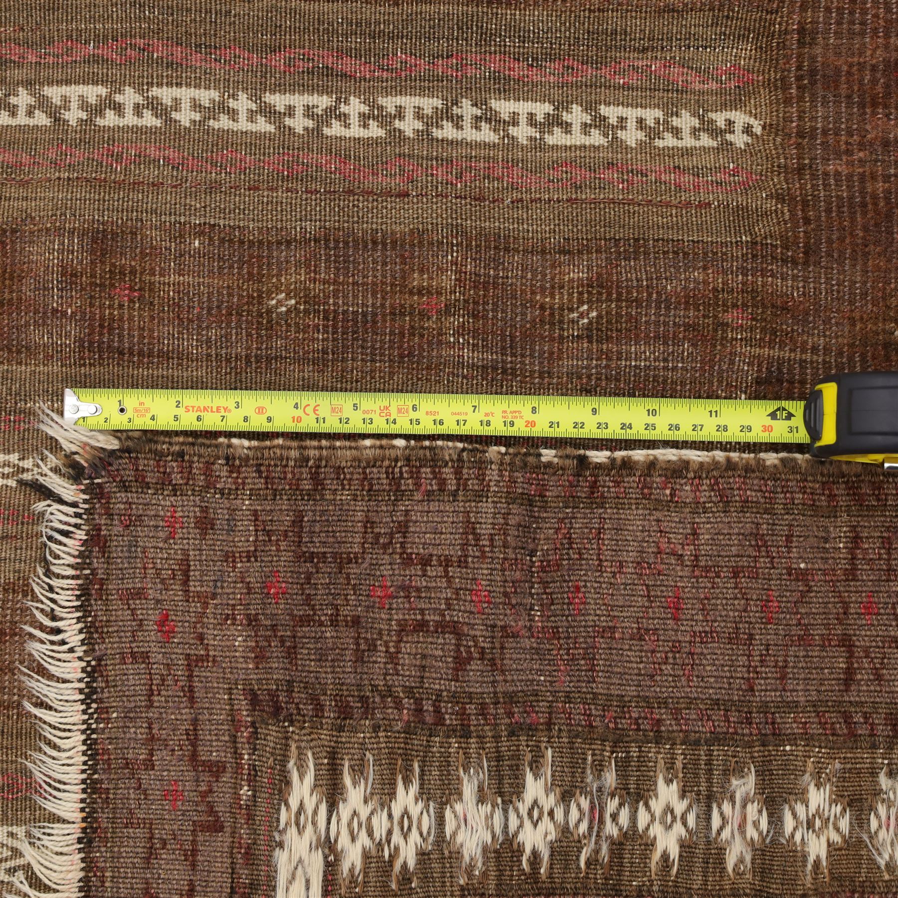 Tekke Turkman rug, madder red field decorated with repeating rows of octagonal guls, framed by multiple geometric borders, 86x133cm and an Anatolian flatweave kilim, 95x140cm, (2)