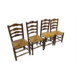 Harlequin set of nine country elm and beech chairs - pair 19th century spindle back carver armchairs with wingbacks, and a mixed set of seven ladderback side chairs, all with rush seats