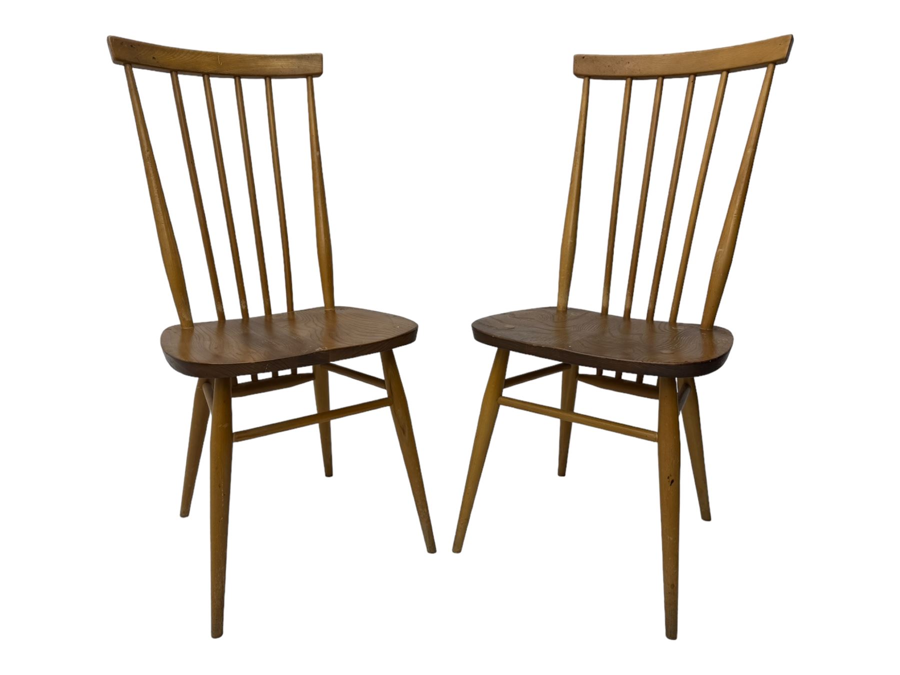 Ercol - pair of mid-20th century highback 'Windsor' chairs, curved top rail over six vertical spindles and shaped seat, on tapering cylindrical supports with stretchers