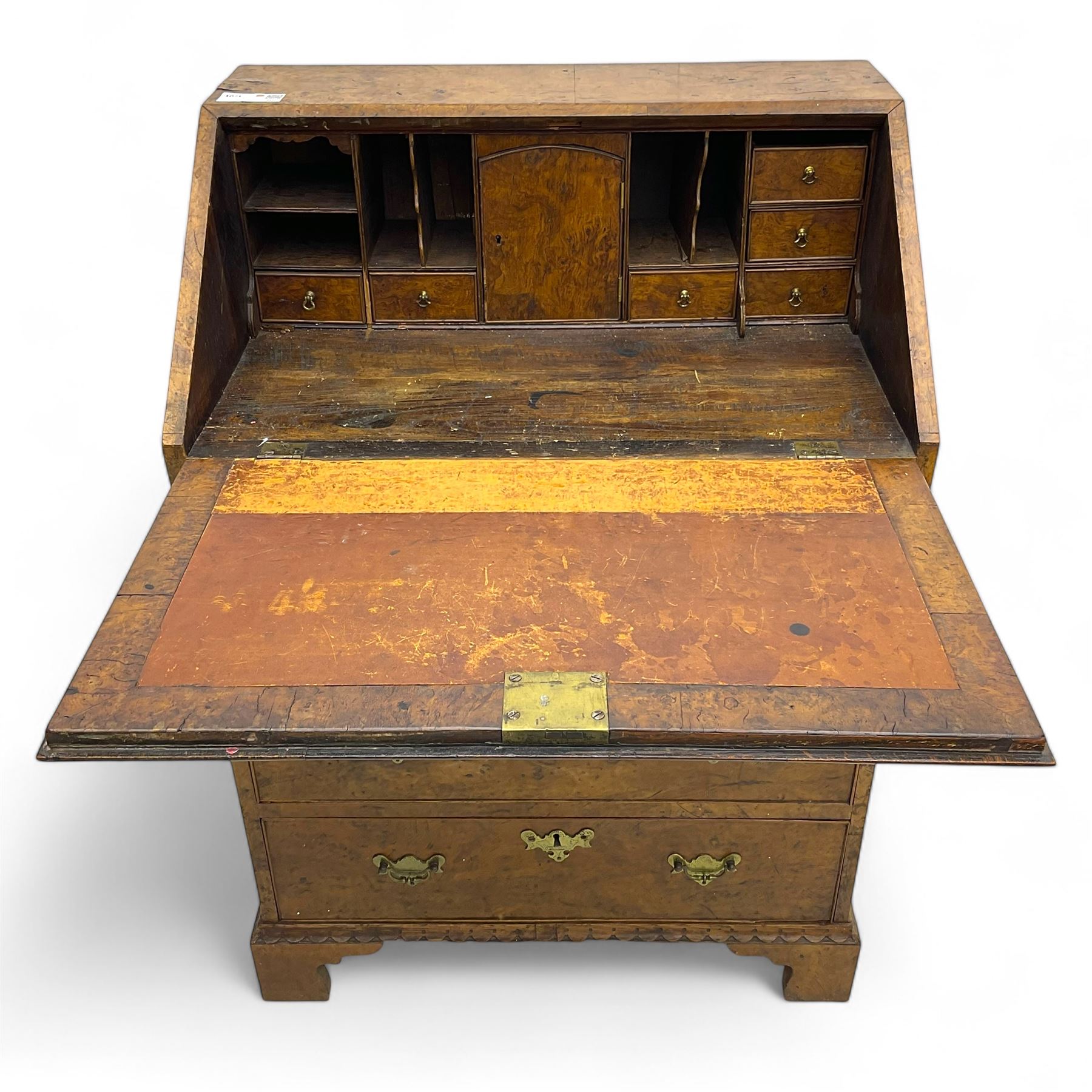 George III figured walnut bureau, fall-front enclosing central cupboard, six pigeonholes and six drawers, fitted with four graduated cockbeaded drawers, on bracket feet