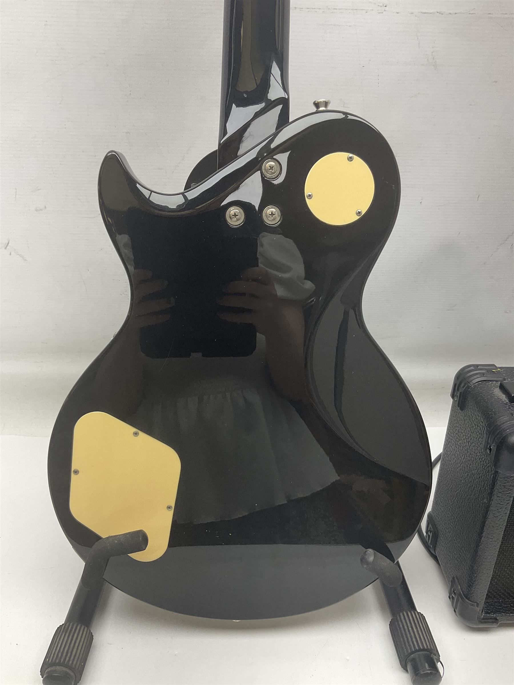 Aria Les Paul style electric guitar, no.037704CH L102cm; with amplifier, soft carrying case and stand; together with various guitar songbooks etc