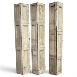 Set of three French 19th century painted pine folding window shutters of tall form, each c...