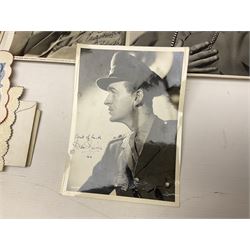 Early 20th century ephemera, to include signed photographs of Charles Boyer and Walter Pidgeon etc, a printed letter from Winston Churchill, two albums and a quantity of transfer books of Players and similar cigarette cards, including Boy Scout and Girl Guide Patrol Signs and Emblems and RAF Badges, a collection of greetings cards and postcards, a photograph album containing black and white photographs of Caius College Cambridge and guides and pamphlets on travelling Switzerland and the UK