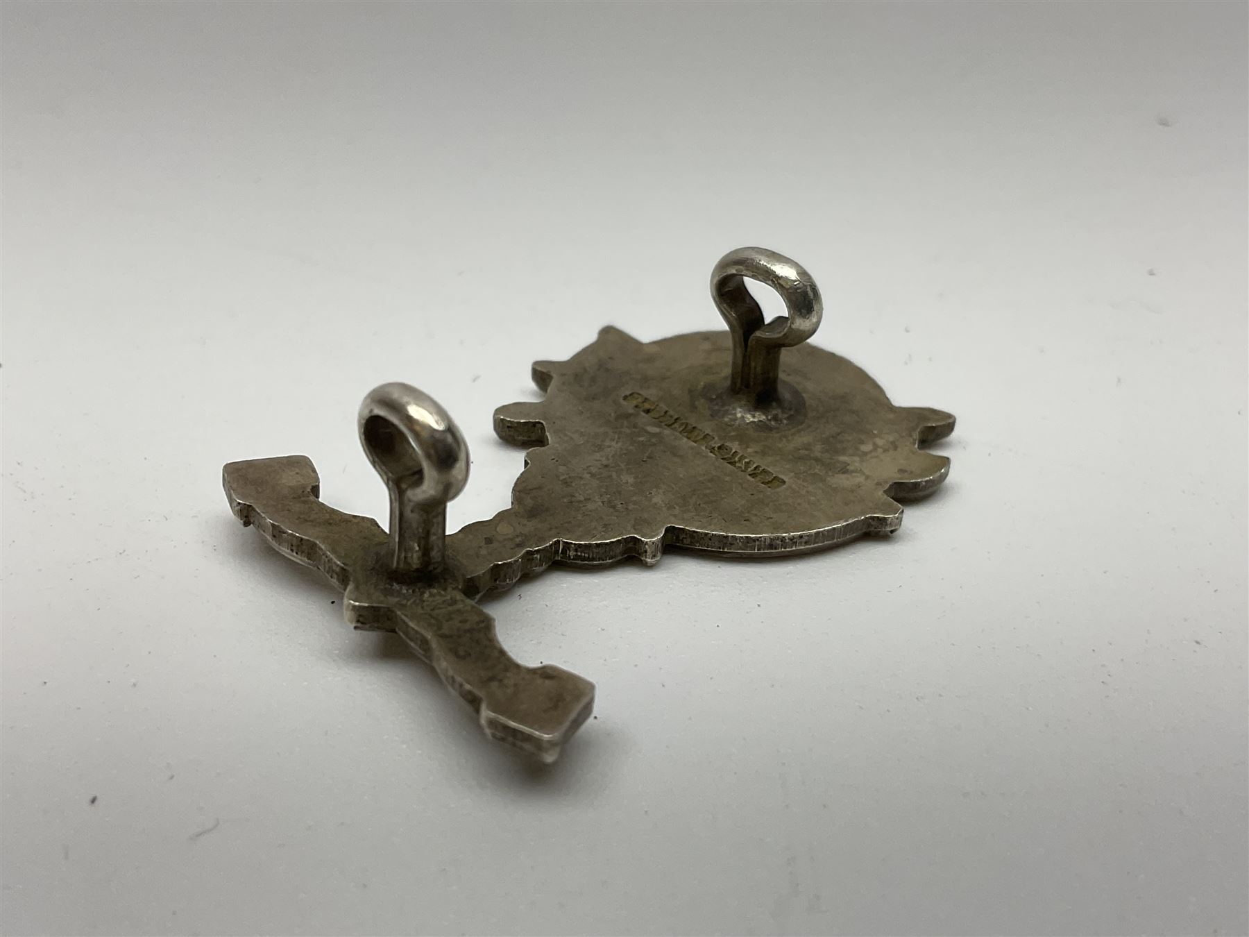 Popski's Private Army sterling silver cap badge; and two silver sweetheart brooches for Highland Light Infantry as a rifle and silver gilt Glengarry badge and Army Service Corps with blue enamel; and another silver badge (4)