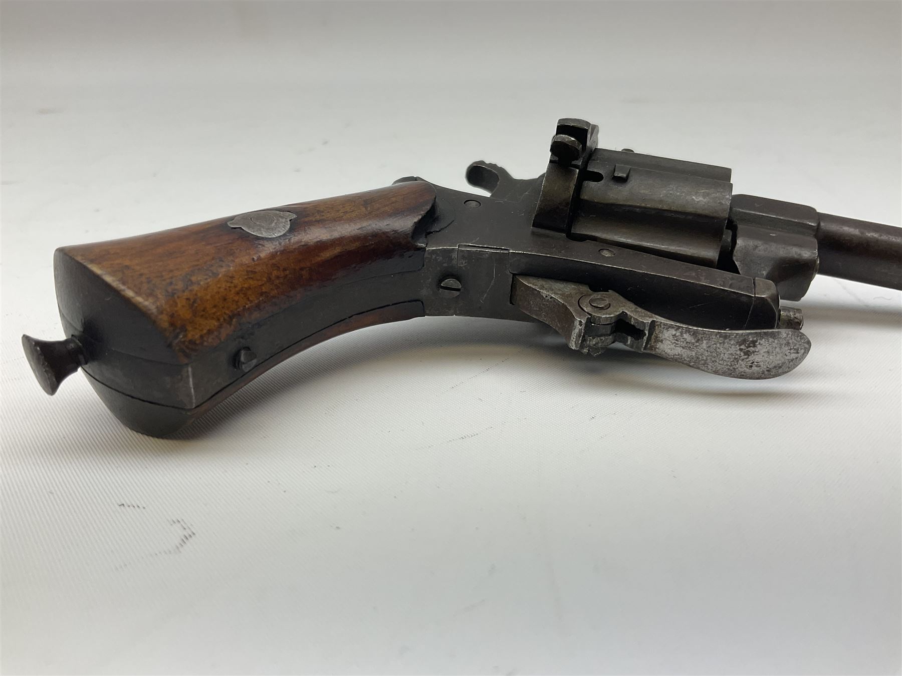 19th century Belgian Flobert 7mm pin-fire revolver with six-shot cylinder, 7cm octagonal to round barrel, folding trigger and walnut stock incorporating ejector rod in butt L18cm overall